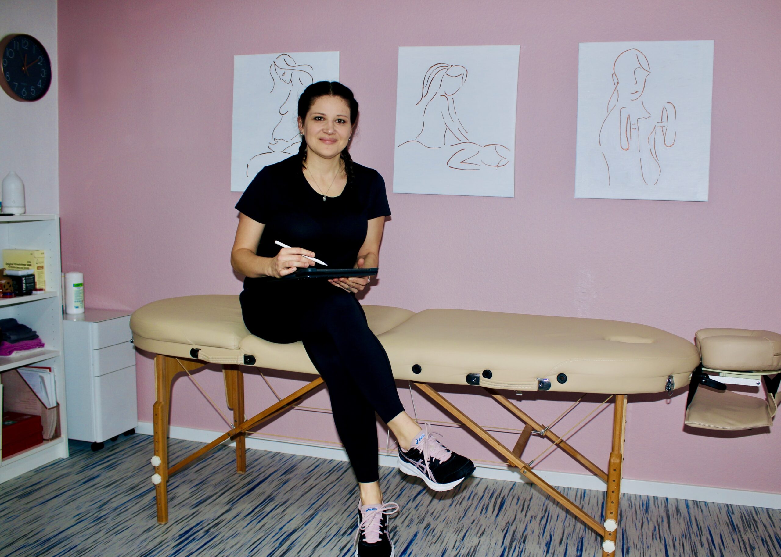 Dori sitting on her workbench